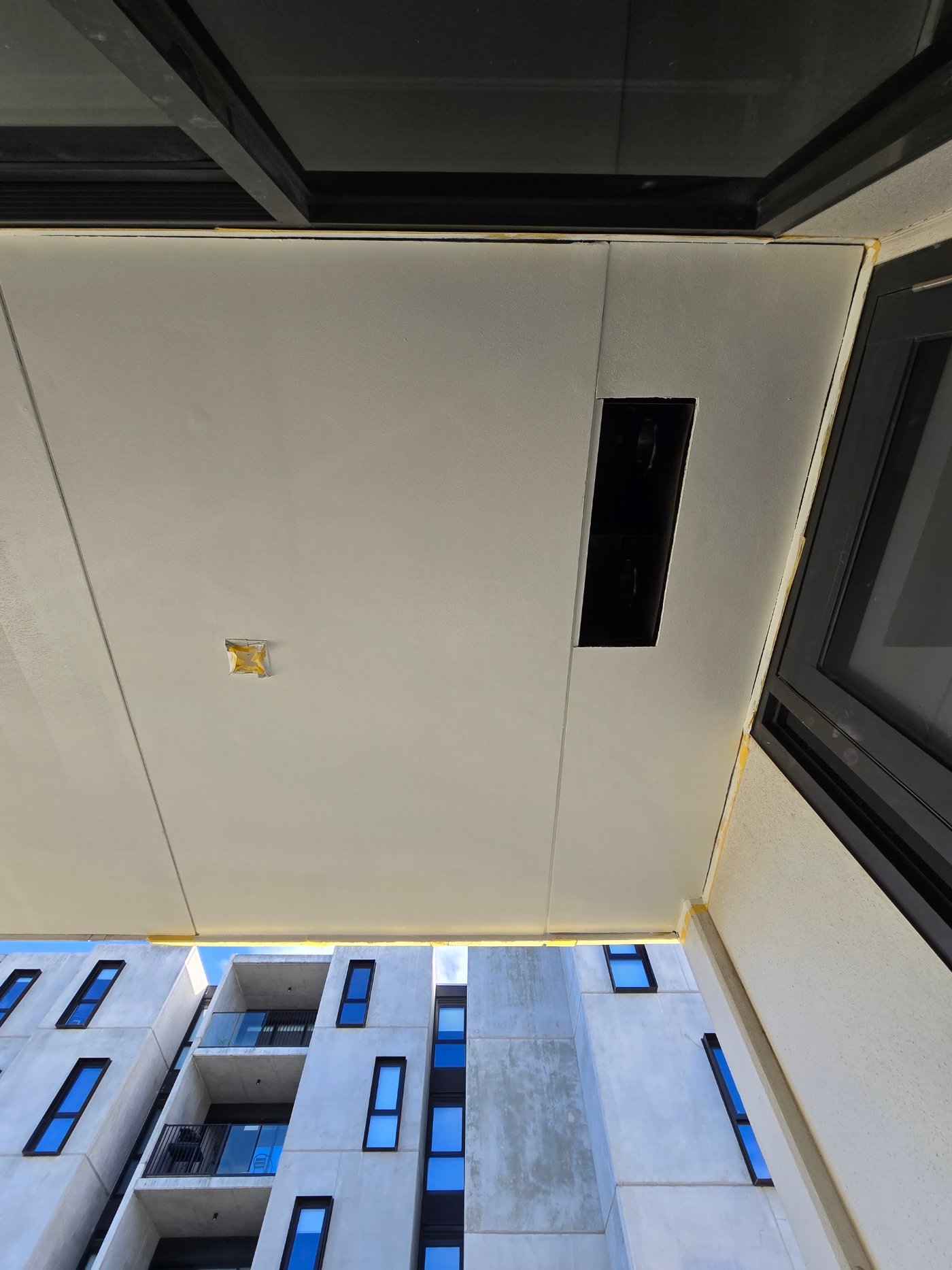 New fibre cement sheet installed and set in the ceiling below the balcony